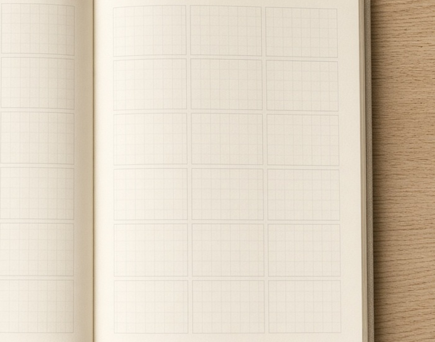 An open cream paper planner with a blank grid and no readable words
